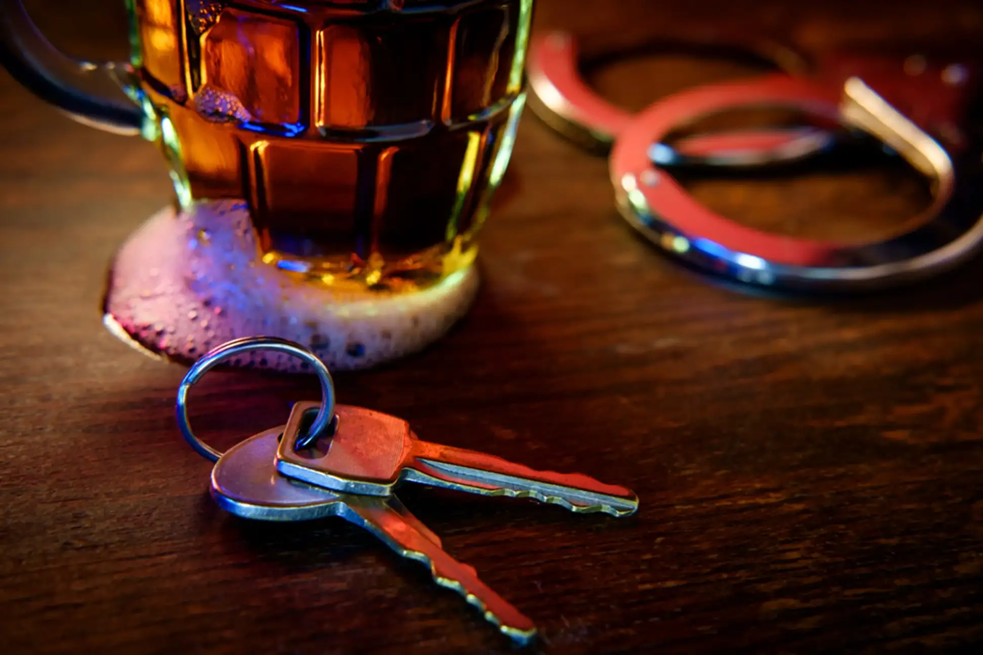 beer mug and keys on a table