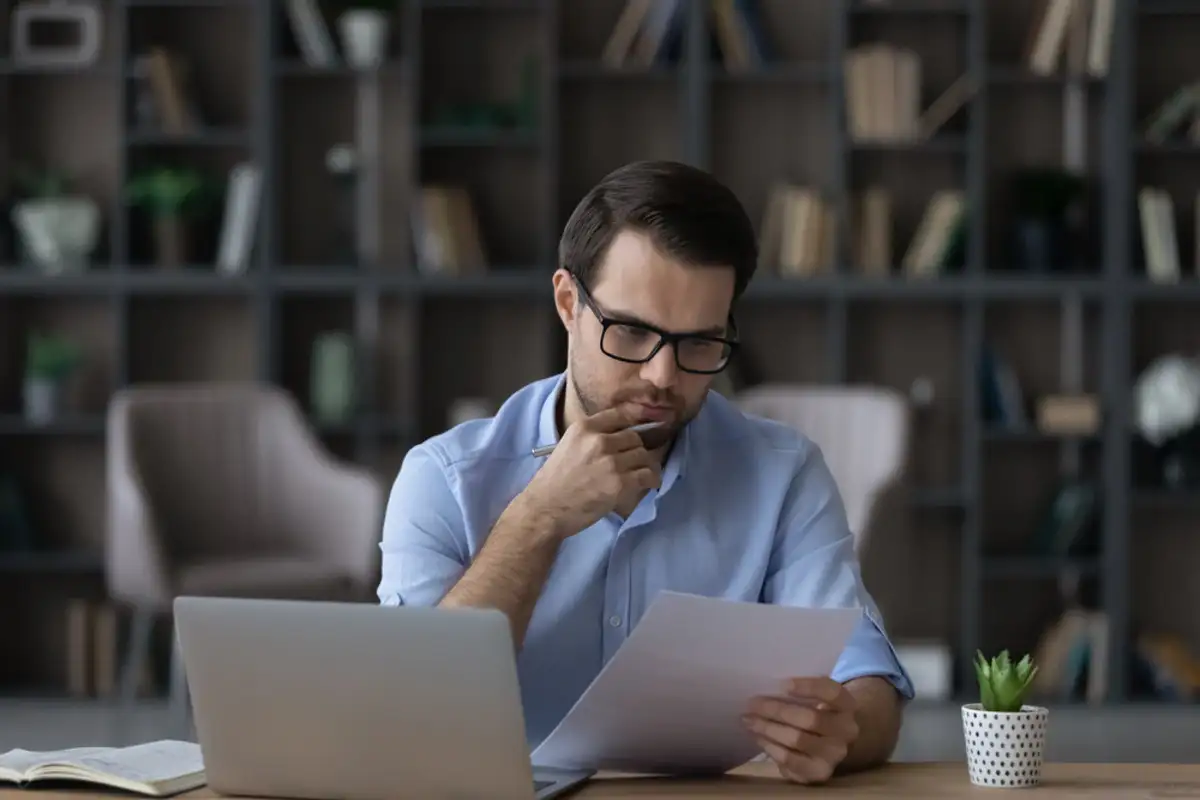 man looking at a document
